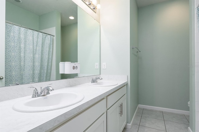 200 Summershore Dr, Auburndale, FL 33823 - full bath with tile patterned flooring, baseboards, and double vanity