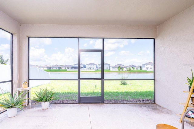 200 Summershore Dr, Auburndale, FL 33823 - unfurnished sunroom with a residential view and a water view