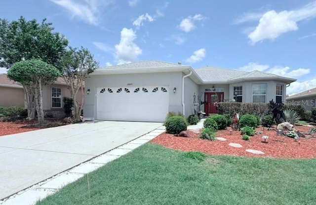 10075 SW 91st Pl, Ocala, FL 34481 - ranch-style house featuring a garage, driveway, stucco siding, and a front yard