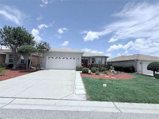 10075 SW 91st Pl, Ocala, FL 34481 - ranch-style house featuring a garage, concrete driveway, stucco siding, and a front yard