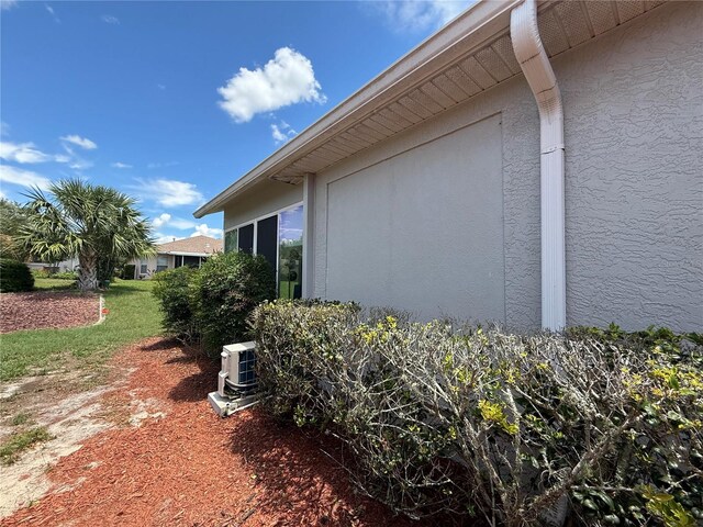10075 SW 91st Pl, Ocala, FL 34481 - view of side of home featuring stucco siding