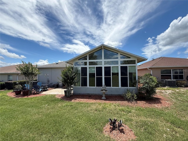 10075 SW 91st Pl, Ocala, FL 34481 - back of house featuring a sunroom, cooling unit, a lawn, and a patio area