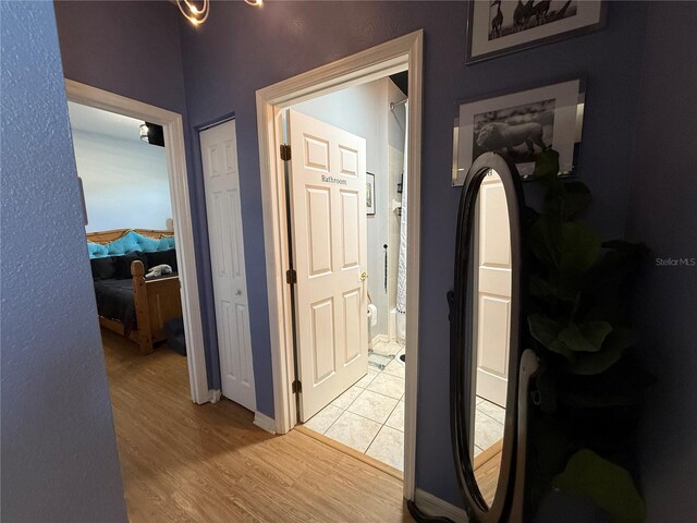 10075 SW 91st Pl, Ocala, FL 34481 - hallway with light wood-type flooring and baseboards