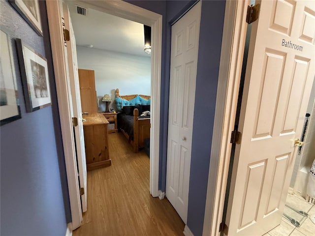 10075 SW 91st Pl, Ocala, FL 34481 - hallway featuring wood finished floors