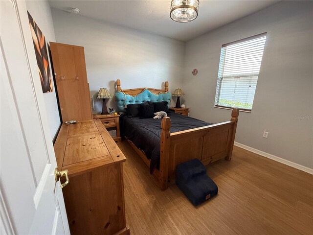 10075 SW 91st Pl, Ocala, FL 34481 - bedroom featuring wood finished floors and baseboards
