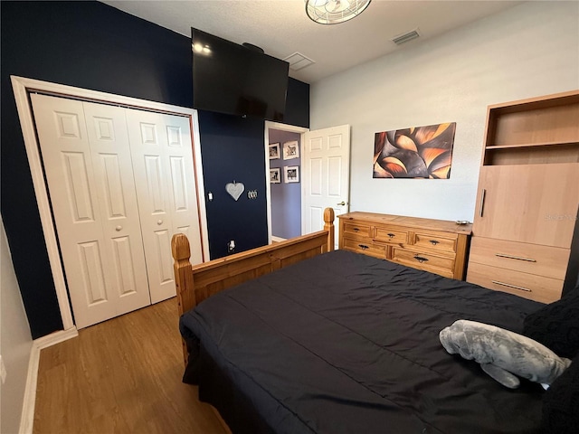 10075 SW 91st Pl, Ocala, FL 34481 - bedroom featuring wood finished floors and a closet