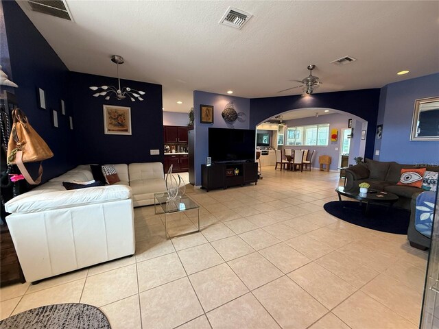10075 SW 91st Pl, Ocala, FL 34481 - living area featuring arched walkways, ceiling fan, light tile patterned floors, and recessed lighting