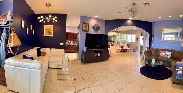 10075 SW 91st Pl, Ocala, FL 34481 - living area featuring arched walkways, light tile patterned floors, a ceiling fan, a chandelier, and recessed lighting