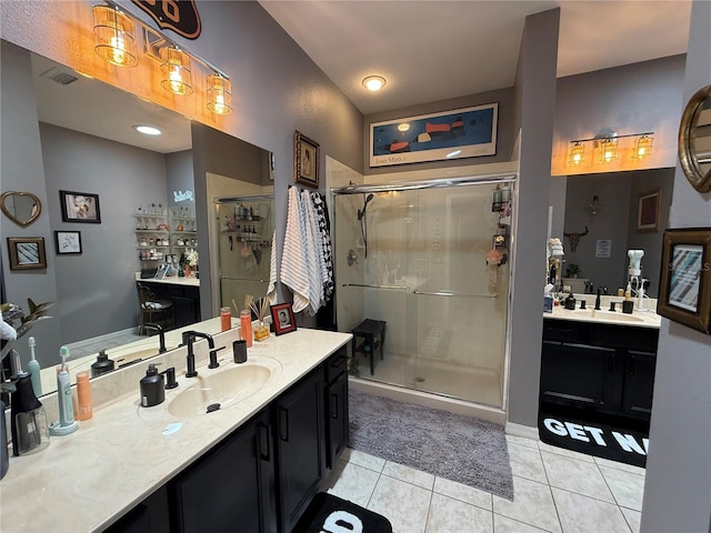 10075 SW 91st Pl, Ocala, FL 34481 - bathroom featuring a shower stall, tile patterned flooring, and two vanities
