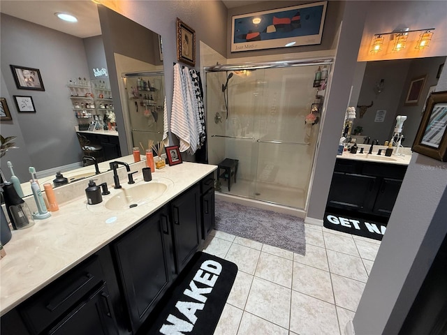 10075 SW 91st Pl, Ocala, FL 34481 - bathroom with a shower stall, tile patterned flooring, and two vanities