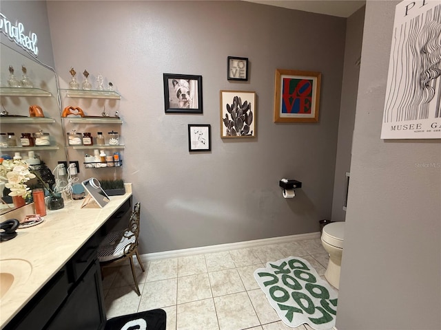 10075 SW 91st Pl, Ocala, FL 34481 - bathroom with tile patterned flooring, baseboards, toilet, and vanity