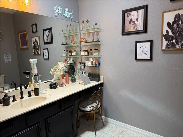 10075 SW 91st Pl, Ocala, FL 34481 - bathroom featuring tile patterned floors, baseboards, and vanity