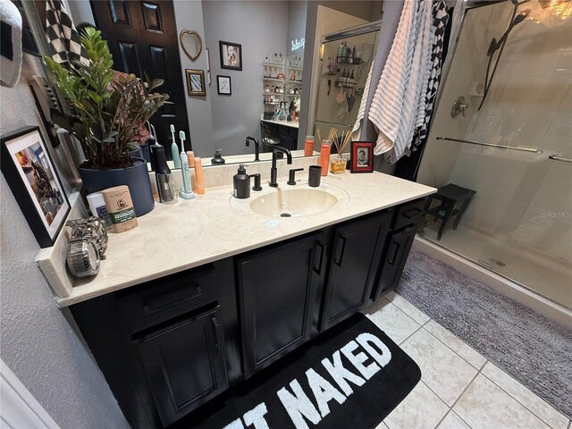 10075 SW 91st Pl, Ocala, FL 34481 - full bathroom with a stall shower, tile patterned flooring, and vanity