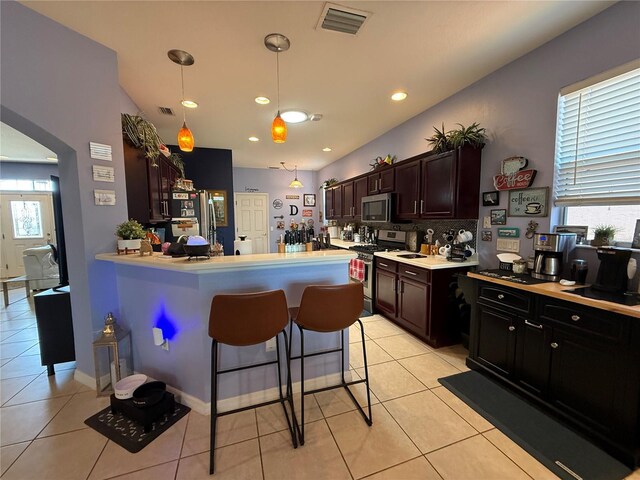 10075 SW 91st Pl, Ocala, FL 34481 - kitchen with stainless steel appliances, healthy amount of natural light, light tile patterned floors, and recessed lighting