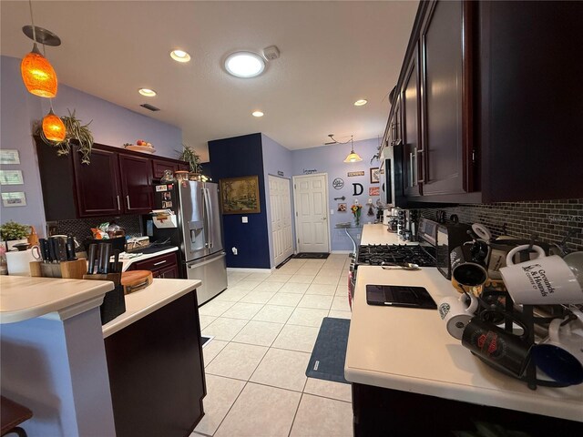 10075 SW 91st Pl, Ocala, FL 34481 - kitchen featuring stainless steel fridge, light countertops, light tile patterned floors, tasteful backsplash, and recessed lighting