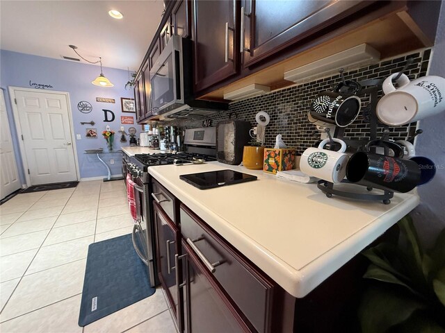10075 SW 91st Pl, Ocala, FL 34481 - kitchen with appliances with stainless steel finishes, backsplash, light countertops, light tile patterned floors, and dark brown cabinetry