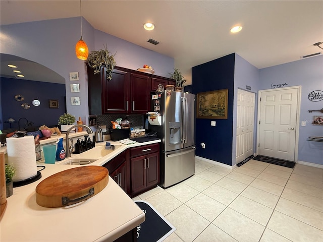 10075 SW 91st Pl, Ocala, FL 34481 - kitchen featuring stainless steel fridge with ice dispenser, a sink, light countertops, tasteful backsplash, and light tile patterned floors