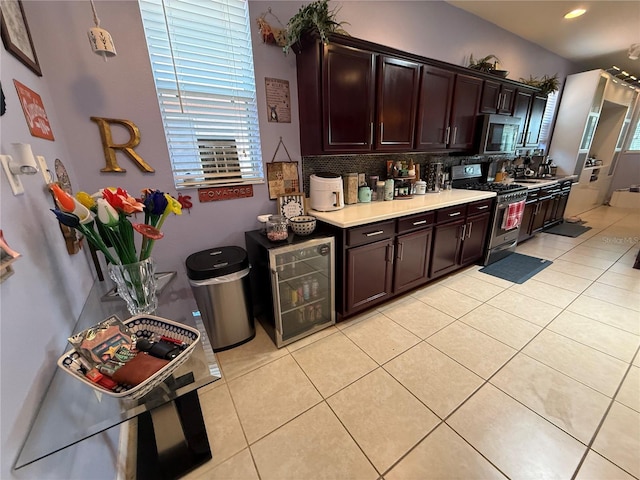 10075 SW 91st Pl, Ocala, FL 34481 - kitchen featuring appliances with stainless steel finishes, light tile patterned floors, light countertops, backsplash, and dark brown cabinets
