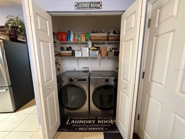 10075 SW 91st Pl, Ocala, FL 34481 - laundry area featuring washer and clothes dryer and tile patterned flooring