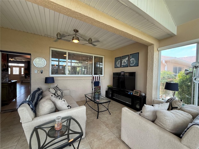 10075 SW 91st Pl, Ocala, FL 34481 - living room with light tile patterned floors, a textured wall, and ceiling fan