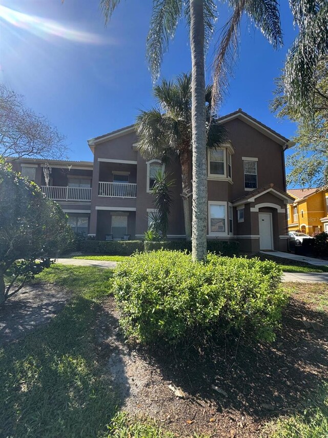 8801 Villa View Cir Unit 207, Orlando, FL 32821 - view of front of home featuring stucco siding