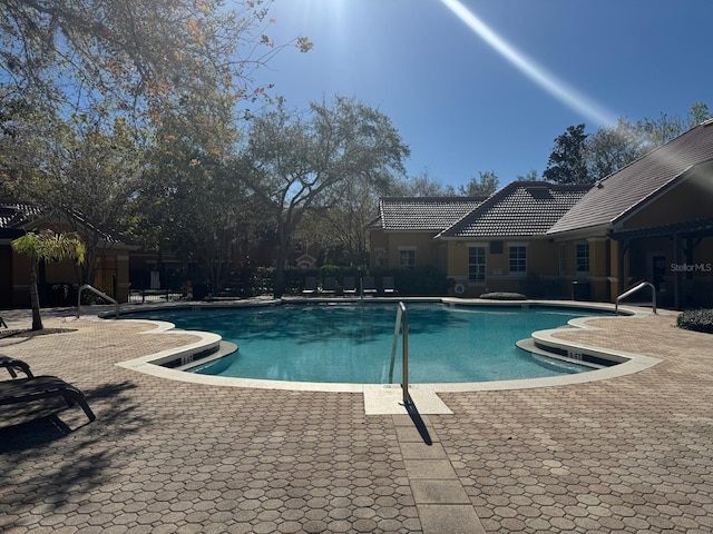 8801 Villa View Cir Unit 207, Orlando, FL 32821 - community pool with a patio