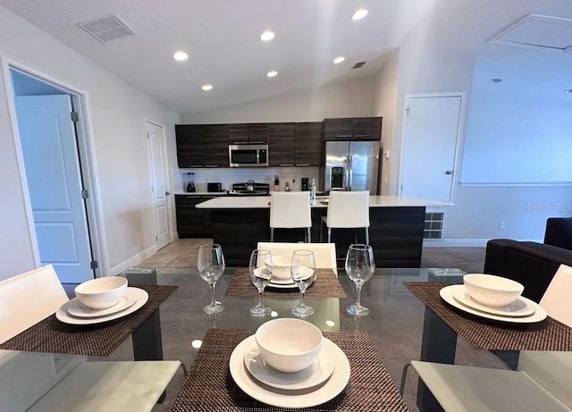 145 Kenny Blvd, Haines City, FL 33844 - dining area featuring vaulted ceiling, recessed lighting, and baseboards