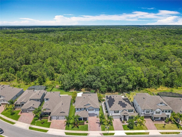 aerial view of residential area with a forest