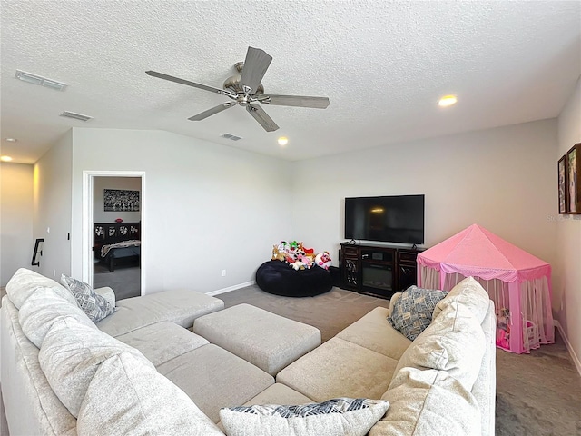 carpeted living area with baseboards, a ceiling fan, a textured ceiling, recessed lighting, and lofted ceiling