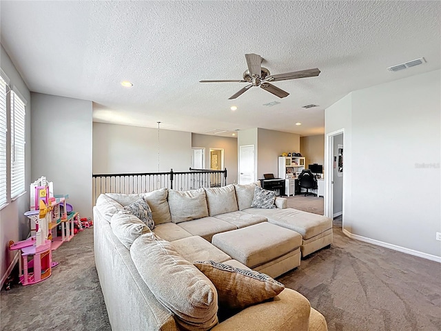 living area featuring carpet flooring, a ceiling fan, a textured ceiling, baseboards, and recessed lighting