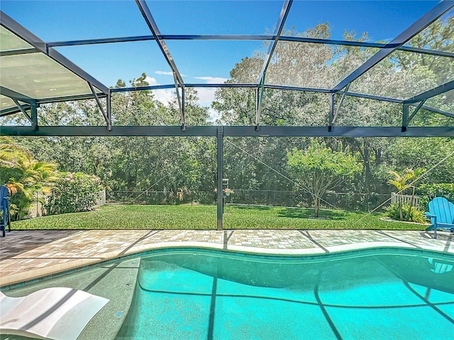 outdoor pool featuring a yard, a patio, and a lanai