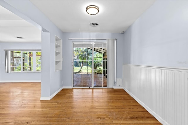 360 W University Ave, Orange City, FL 32763 - entryway featuring wood finished floors and wainscoting