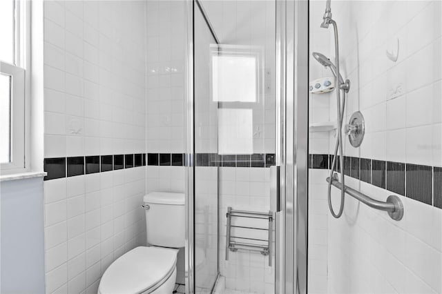 360 W University Ave, Orange City, FL 32763 - full bath featuring tile walls, a stall shower, and toilet