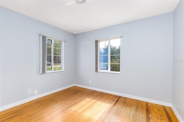 360 W University Ave, Orange City, FL 32763 - spare room featuring light wood-style flooring and baseboards