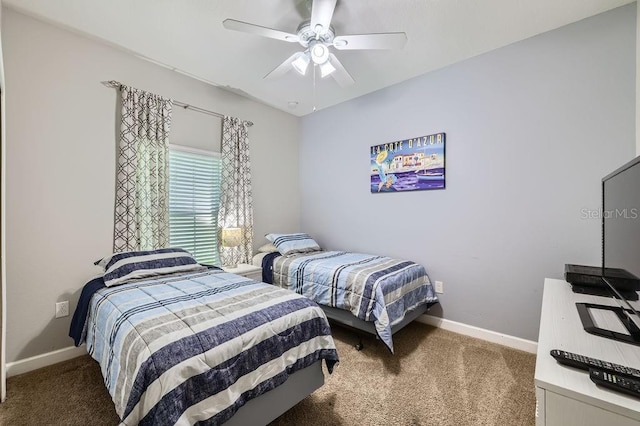 3055 Beach Palm Ave, Kissimmee, FL 34747 - bedroom featuring carpet, baseboards, and a ceiling fan