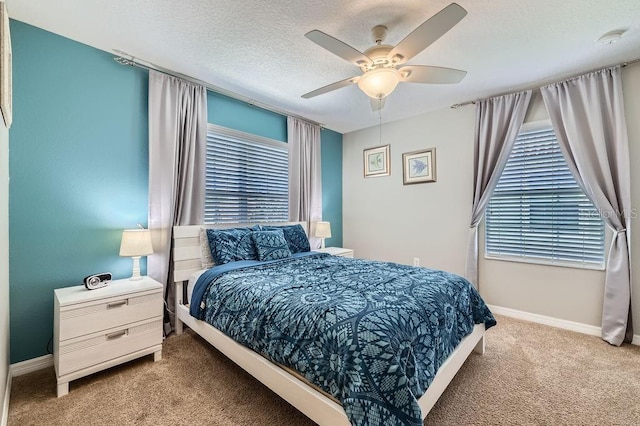3055 Beach Palm Ave, Kissimmee, FL 34747 - carpeted bedroom featuring baseboards, ceiling fan, and a textured ceiling