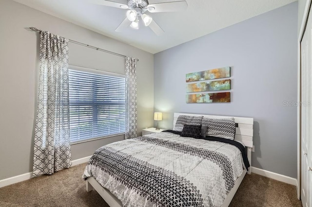 3055 Beach Palm Ave, Kissimmee, FL 34747 - bedroom featuring carpet, baseboards, and a ceiling fan