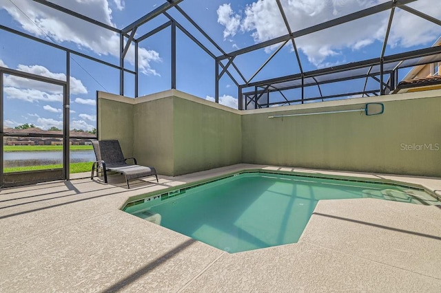 3055 Beach Palm Ave, Kissimmee, FL 34747 - swimming pool featuring a patio, glass enclosure, and a water view