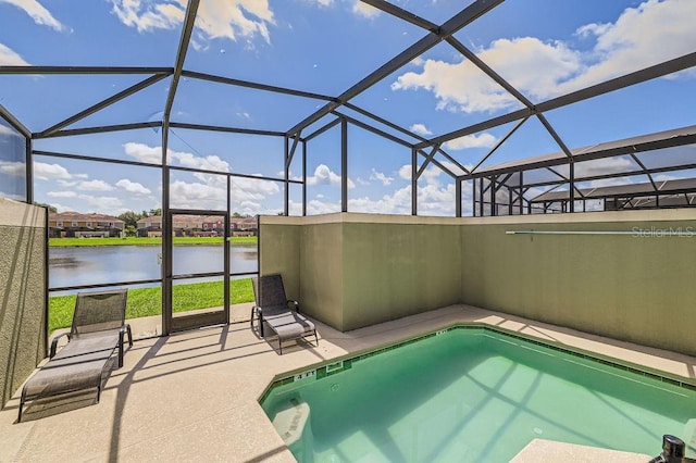 3055 Beach Palm Ave, Kissimmee, FL 34747 - outdoor pool featuring a water view, a patio area, and a lanai
