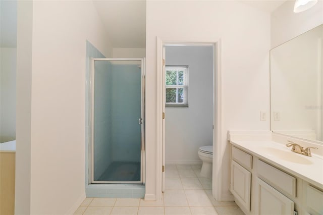 1243 Tangerine Cir, Lady Lake, FL 32159 - full bath with vanity, a stall shower, toilet, baseboards, and tile patterned floors
