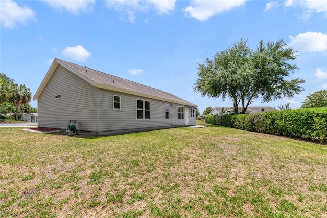 1243 Tangerine Cir, Lady Lake, FL 32159 - back of property with a yard