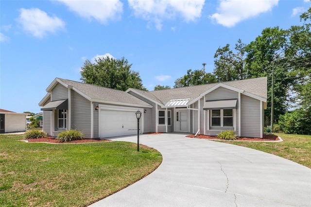 1243 Tangerine Cir, Lady Lake, FL 32159 - view of front of home featuring a garage, driveway, a front lawn, and roof with shingles