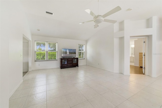 1243 Tangerine Cir, Lady Lake, FL 32159 - unfurnished living room with light tile patterned floors, ceiling fan, baseboards, and high vaulted ceiling