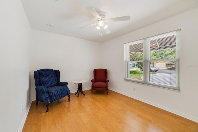 1243 Tangerine Cir, Lady Lake, FL 32159 - sitting room featuring light wood-style flooring, baseboards, and ceiling fan