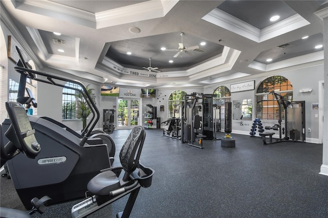 workout area featuring a raised ceiling, crown molding, ceiling fan, baseboards, and recessed lighting