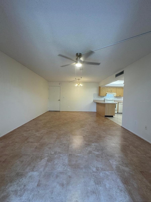 21260 Brinson Ave Unit 109, Port Charlotte, FL 33952 - unfurnished living room featuring a ceiling fan and a textured ceiling