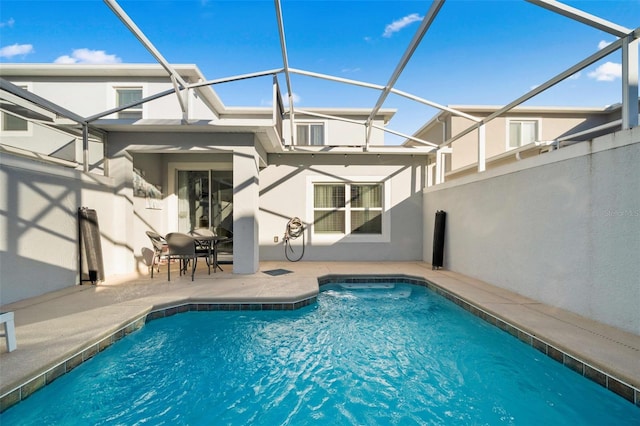 1128 Challenge Dr, Davenport, FL 33896 - swimming pool featuring a patio area and glass enclosure