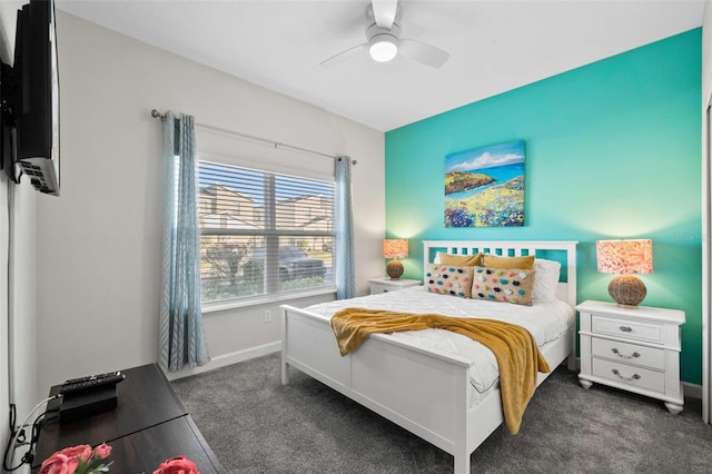 1128 Challenge Dr, Davenport, FL 33896 - bedroom featuring dark carpet, baseboards, and a ceiling fan