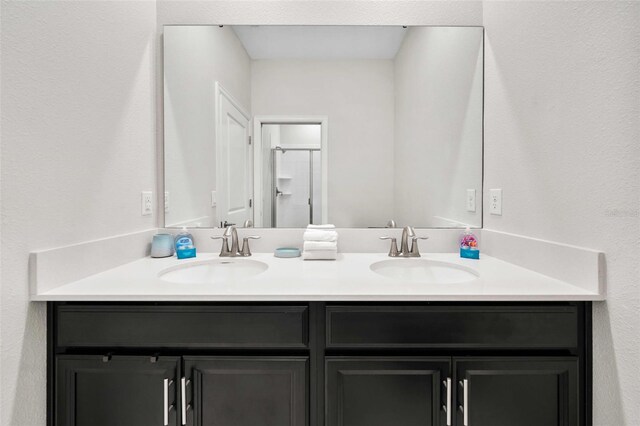 1128 Challenge Dr, Davenport, FL 33896 - full bathroom featuring double vanity and a shower with shower door