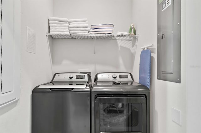 1128 Challenge Dr, Davenport, FL 33896 - laundry room with washer and clothes dryer and electric panel